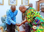 Dr John Jinapor shaking hands with Togbe Afede XIV