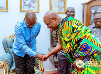 Dr John Jinapor shaking hands with Togbe Afede XIV
