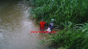 Some residents fetching water from the polluted river