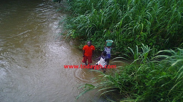 Some residents fetching water from the polluted river