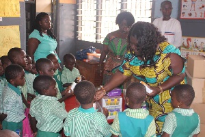 Sandra Owusu Ahenkorah interacting with some pupils of basic schools in her catchment area