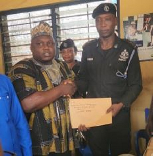 Sarkin Hausa presenting the items to the Odorkor police command