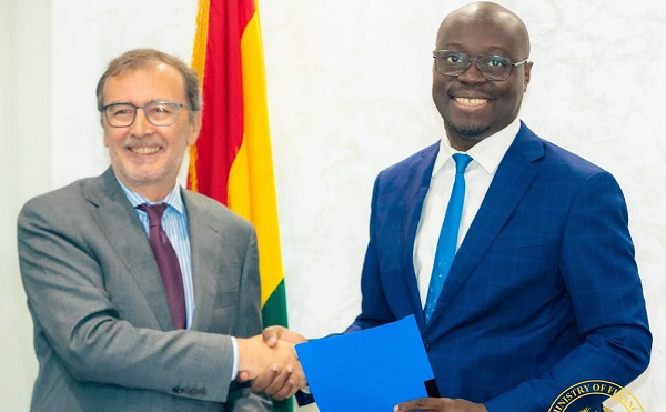 Ángel Lossada Torres-Quevedo (L) in a handshake with Dr Cassiel Ato Forson (R)
