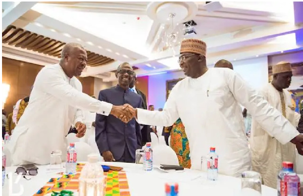 Dr Mahamudu Bawumia shaking hands with John Dramani Mahama