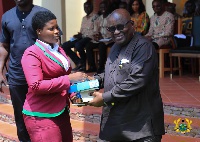President Nana Addo Dankwa Akufo-Addo presenting an award to a student