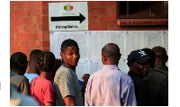 People queue to cast their vote at Kuwadzana school in Harare, Zimbabwe, on August 23