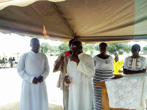 Msgr. Roger Aboteyuure [centre]