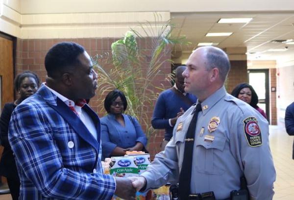 Capt Michael F. Grinnan (L) shakes has with Bishop Adonteng Boateng (R)