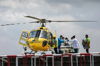Medics and rescuers transfer mountaineer Dawa Sherpa from helicopter upon his arrival at a hospital