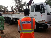 File photo: An officer from NADMO supervising the distribution of some relief items