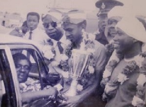 The late B.K. Edusei (in car) receiving a trophy from then Kotoko captain Ibrahim Sunday