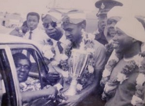 The late B.K. Edusei (in car) receiving a trophy from then Kotoko captain Ibrahim Sunday