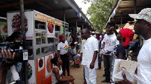 William Dowokpor Interacting With Some Food Vendors