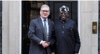 Prime Minister Sir Keir Starmer is seen shaking hands with Nigerian President Bola Ahmed Tinubu