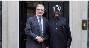 Prime Minister Sir Keir Starmer is seen shaking hands with Nigerian President Bola Ahmed Tinubu