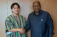 Doga Makiura (Left) in a handshake with President John Dramani Mahama (Right)