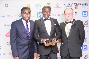 Nana Kwame Bediako flanked by the mayor of Greenwich, Norman Adams (R) and Eugene Akwasi-Ayisi (L)