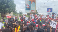 Protesters display placards during the march