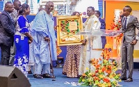Pastor Agyinasare presenting special plaques to Former President John Agyekum Kufuor