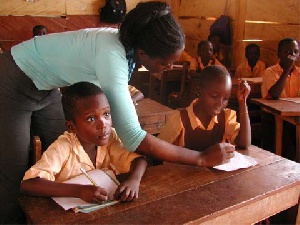 A female teacher in class with her students