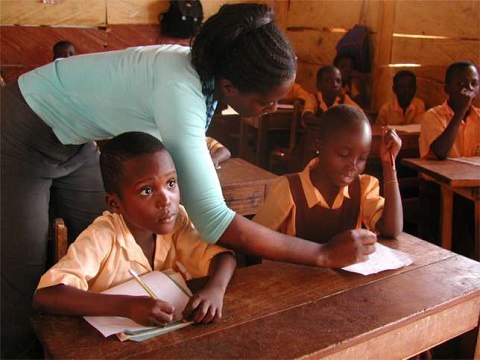 A female teacher in class with her students