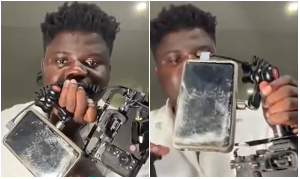 Wode Maya showing off his damaged camera