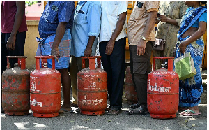 People queue up to buy cooking gas cylinders for domestic use in Chennai