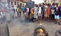 Tyres were burnt and people held placards at the Japekrom violence in Drobo