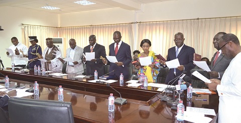 Mr Ken Ofori Atta (right), the Minister of Finance, swearing in the new Board Members of SSNIT.