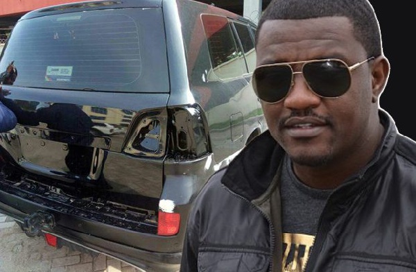 John Dumelo with an inset of the car