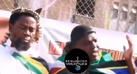Screenshot from video of activist making a call to African governments to evacuate nationals