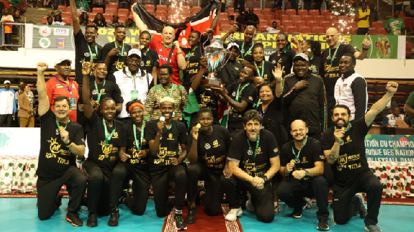 Malkia Strikers players celebrate with the trophy after beating Egypt