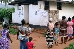 People in a queue to use the washroom