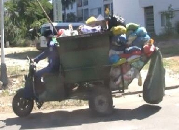 An 'aboboyaa' being used to collect waste