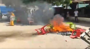 Some supporters of NDC setting ablaze chairs at the constituency office on fire