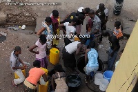 File photo of residents queuing for water