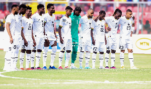 Players of the Black Stars pose for a picture before a game