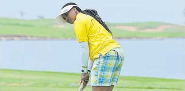 Tanzania's top lady golfer, Madina Idd takes a shot during a past competition
