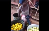 This woman was seen dipping peeled oranges into a solution to impact the colour