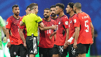 Egyptian players having a conversation with the referee
