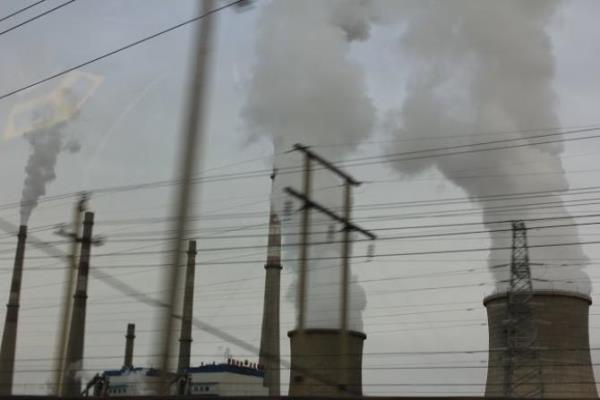 Fumes from a manufacturing company fill the air