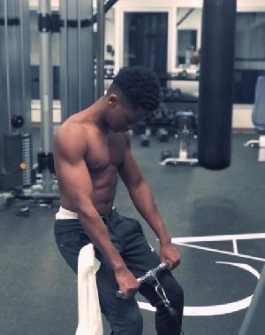 Ghanaian actor Abraham Attah at the gym showing off his six-packs