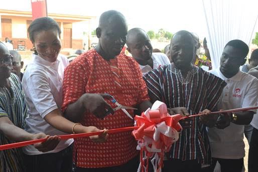 Kwame Osafo-Amoah, Airtel Zonal Business Manager (middle) being aided to commission the facility