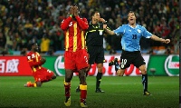 Asamoah Gyan mourning his goal loss