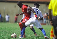 Asante Kotoko's George Mfegue in action against Berekum Chelsea