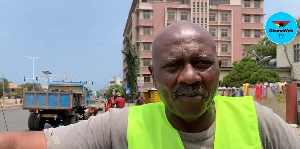 This man cleans gutters around offices in Accra and presents bills to the companies afterwards