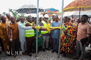 George Mireku Duker cutting the ribbon for official opening of the project
