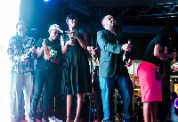 YFM's Dj Kess, Caroline Sampson, Eddy Blay Jnr and others popping champagne on stage