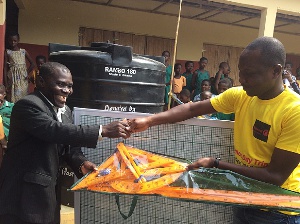 Head of the school receiving the items