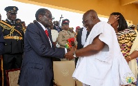 President Akufo-Addo exchanging pleasantries with President Robert Mugabe